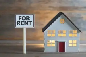 Buy-to-Let Mortgage a miniature house with a for rent sign outside