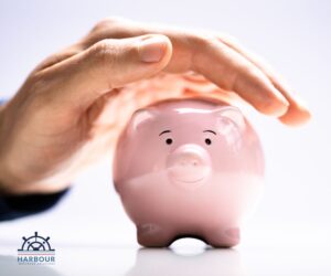 Income protection insurance a hand over the top of a piggy bank