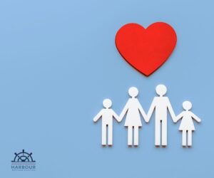 Life assurance a red heart above a paper family in white