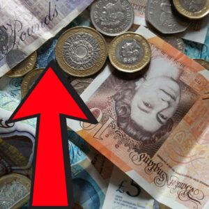British coins and notes with a red arrow pointing up for the Mortgage Rates UK blog
