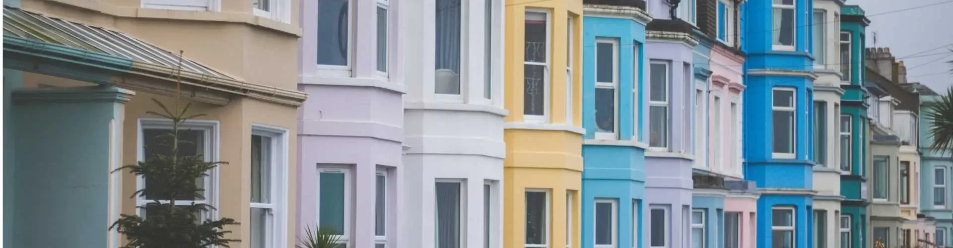 Harbour Mortgage Solutions Banner Mortgage Brokers South Wales A row of colourful houses