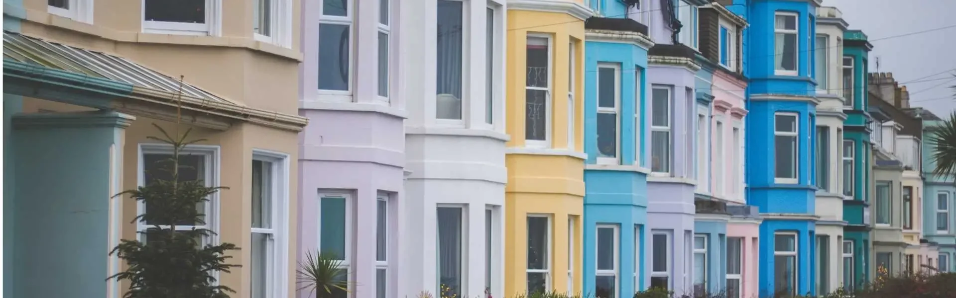 Harbour Mortgage Solutions Banner Mortgage Brokers South Wales A row of colourful houses